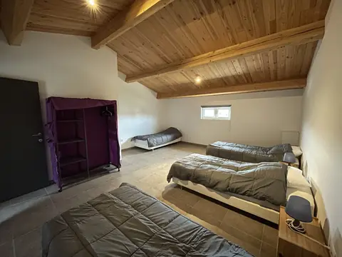 Eerste slaapkamer op de verdieping van vakantiewoning 1