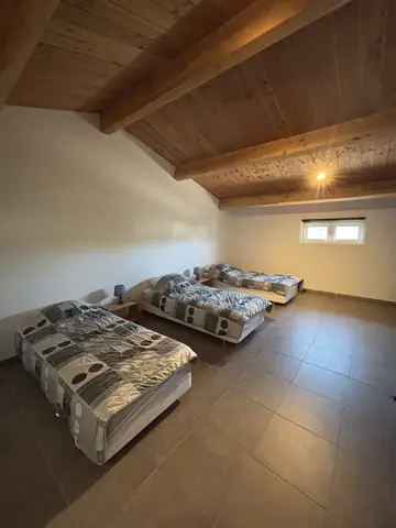 Slaapkamer met vier bedden van vakantiewoning 3
